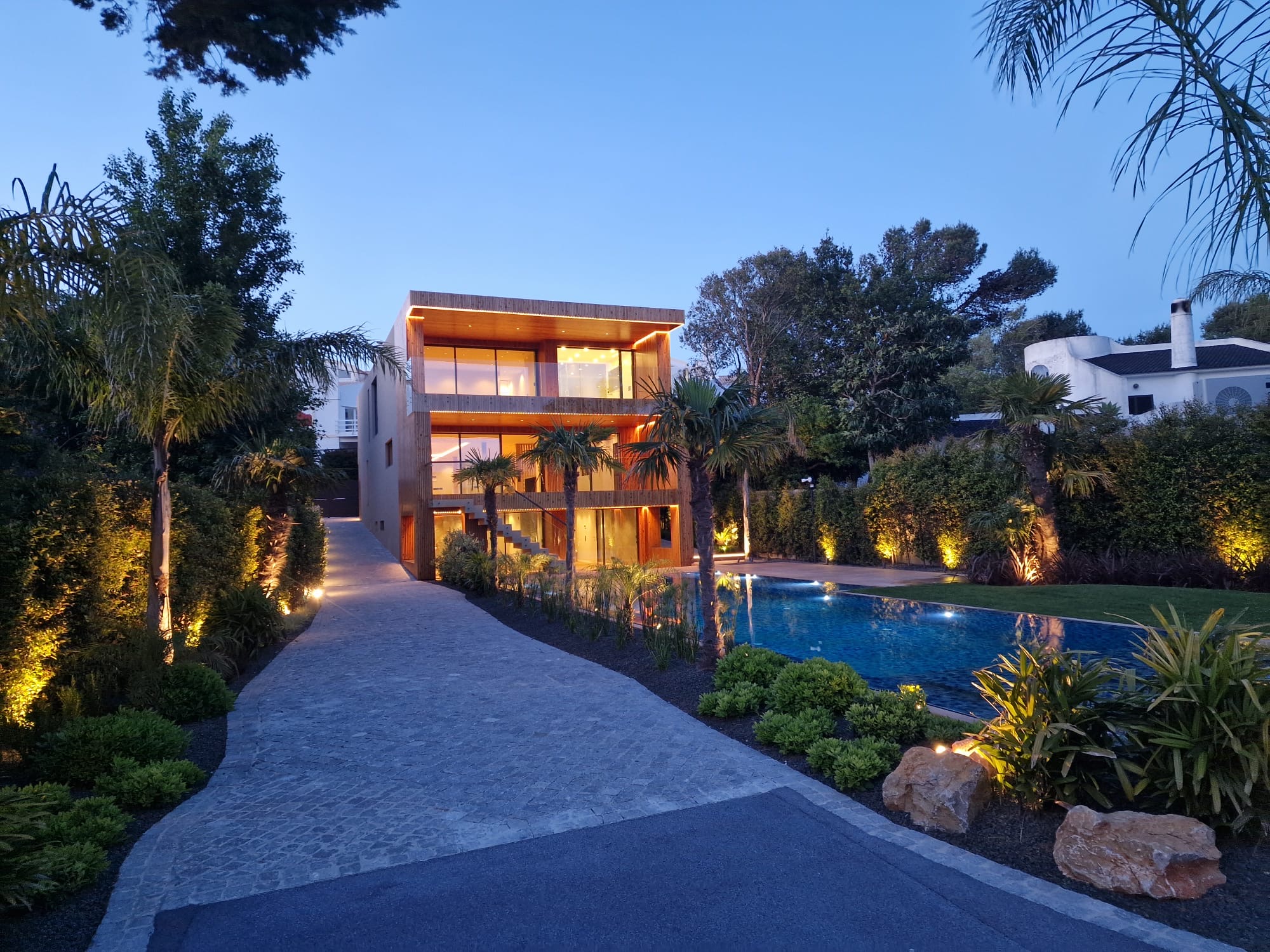 Illuminated garden and architectural entrance